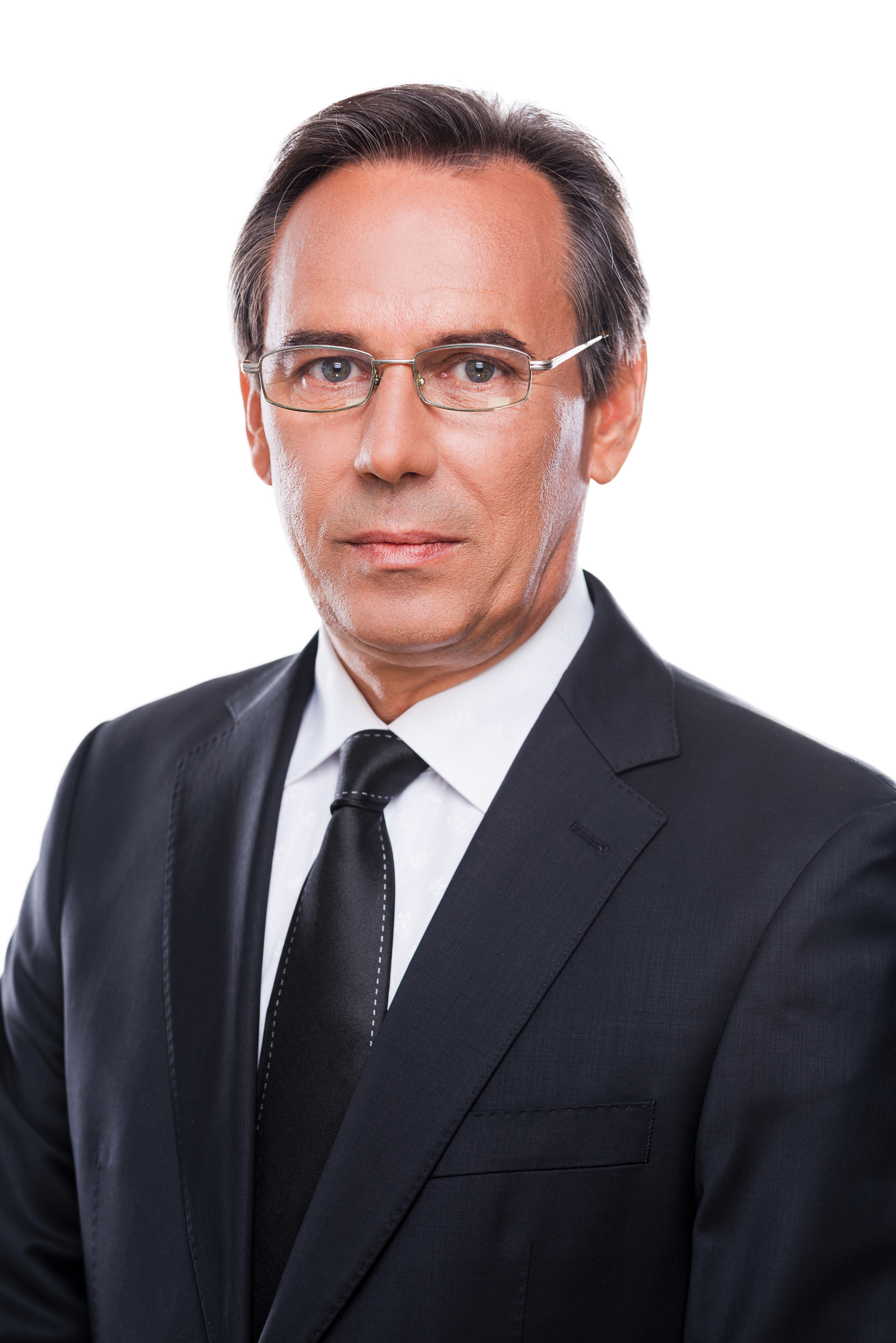Confident business expert. Portrait of confident mature man in formalwear and eyeglasses looking at camera while standing against white background